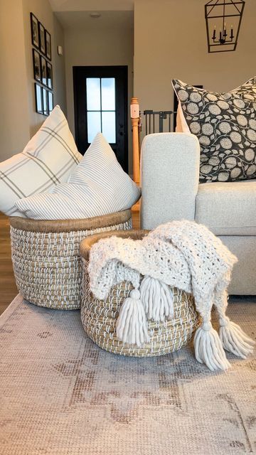 Logan Maggio | Home Decor Inspo + DIY on Instagram: "A simple way to create a cozy space is adding large baskets with pillows and throws. This set is from @305decoliving and I’m obsessed 🙌🏼 Follow my home journey on Instagram @JustAnotherWhiteHouse Curious where something is from? You can find links to my home on the free LTK app! Follow @JustAnotherWhiteHouse for exclusive app only content 🤍 #livingroom #livingroomdecor #cozy #cozydecor #cozyhome #cozyhomes #cozylivingroom #livingroominspira Living Room Throw Basket, Basket With Pillows Living Rooms, Throw Baskets Living Rooms, Large Basket Decor Ideas, Apartment Decor Bathroom, Blanket Storage Living Room, Makeover Living Room, Home Decor Thrift, Workspace Organization