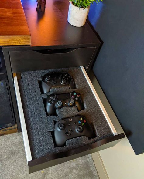 4 Video Game Controller Storage Ideas - TheHomeRoute Game System Storage Ideas, Video Game Storage Ideas Hidden, Xbox Storage Ideas, Controller Display, Hidden Video Game Storage, Gamer Organisation, Controller Organization, Xbox Controller Storage Organizing Ideas, Game Console Storage