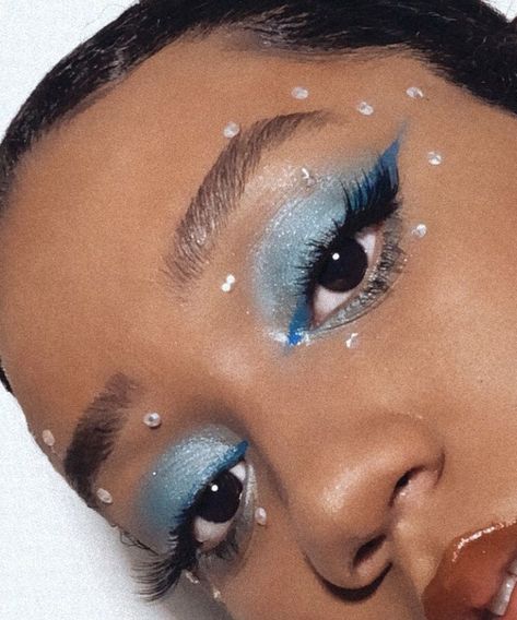 Taylor Swift Eye Makeup 1989, Euphoria Cheerleader Makeup, Light Blue Euphoria Makeup, 1989 Makeup Looks, Sky Makeup Look, Blue Makeup Looks With Gems, Cheerleading Makeup Ideas Glitter, Blue Makeup With Rhinestones, 1989 Makeup Taylor