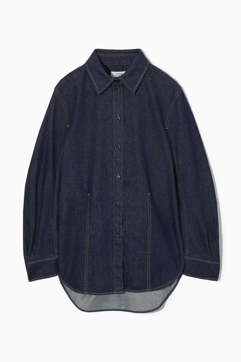 This utility-inspired piece is designed for an oversized cut and can be styled as a shirt or jacket. It's crafted from organic- and recycled cotton-blend denim and has a rounded shape that's enhanced by the dropped shoulders, slightly flared sleeves and stepped hem. The heavy topstitching and paneled construction define the silhouette. Oversized fit, pleated sleevesPointed collar, button closureOrganic cotton is grown from non-genetically modified seeds without chemical fertilizers or pesticides 80% Organic cotton, 20% Recycled cotton / Machine wash Back length of size 6 is 30.90" / Model wears a size 6 Oversized Button Up, Oversized Denim Shirt, Pleated Sleeves, Power Dressing, Genetically Modified, Silk Print Dress, Cardigan Top, Poplin Shirt, Oversized Shirt