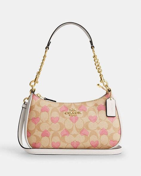 COACH® | Teri Shoulder Bag In Signature Canvas With Heart Print Coach Beige Bag, Pretty Bags Fashion, Pink Coach Shoulder Bag, Purse With Outfit, Heart Coach Bag, Coach Heart Purse, Spring Crossbody Shoulder Bag In Coated Canvas, Spring Coated Canvas Crossbody Shoulder Bag, Spring Crossbody Bag In Coated Canvas