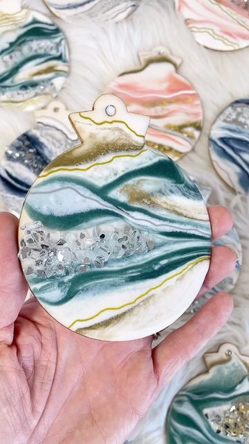 Samantha Steffen on Instagram: "WOW! Last night’s turn out for my 2024 ornament launch was INCREDIBLE! Thank you all for showing up and sharing your enthusiasm for these handmade geode holiday beauties! 

You can find all of the details about the ornaments available through samandseaartistry.com or by clicking the shop link in my bio! 

.
.
.
.
.
.
#ornaments #ornament #geode #gemstone #treeornaments #christmasornaments #christmastree #christmasdecor #handpainted #milspouse #milspo #armylife" Holiday Beauty, Army Life, Tree Ornaments, Last Night, Christmas Decorations, Christmas Tree, Hand Painted, The Incredibles, Christmas Ornaments