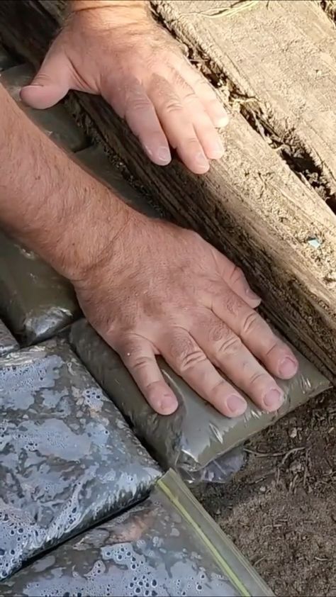 hometalk on Instagram: Lay ziploc bags full of cement in your backyard...😱 @goodlyearth⁠ .⁠ .⁠ @ziploc⁠ .⁠ .⁠ #DIY #HowTo #Garage #Makeover #DIYProject… Cement Bag Wall, Cement Pavers, Diy Path, Concrete Bags, Concrete Walkway, Concrete Pad, Garage Makeover, Concrete Pavers, Concrete Garden