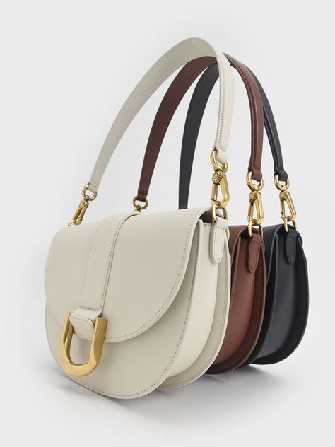 Trending Handbags, Neutral Bag, Saddle Bag Purse, Chic Crossbody Bag, Leather Saddle Bags, Fancy Bags, Pretty Bags, Charles Keith, Modern Lifestyle