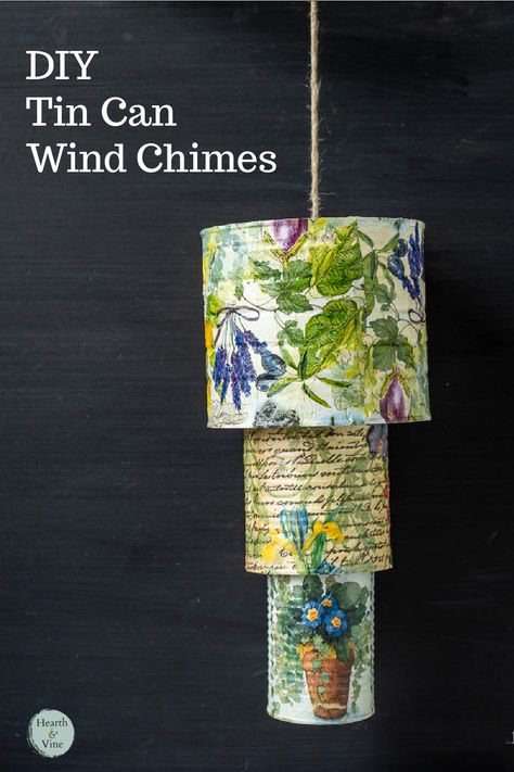 Three tin cans with floral prints hung on twine like a wind chime. Tin Can Wind Chimes, Can Wind Chimes, Carillons Diy, Wind Chimes Homemade, Wind Chimes Craft, Tin Can Art, Aluminum Can Crafts, Tin Can Crafts, Diy Wind Chimes