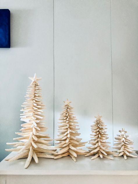 This Christmas tree is made of natural finger starfish.  It is a unique holiday decoration for the winter time. If you miss the beach in the winter this is something that will bring the beach to your home. Please select the tree size from the options added on the right of the picture.  Small - 5.5-6.5 inches tall Medium - 7.5 - 8.5 inches tall Large - 11.5 - 12.5 inches tall Extra Large 15.5 - 18 inches tall  All my trees are well packed for a safe transportation. Unfortunately I cannot accept returns on seasonal products. Seasonal products such as ornaments, wedding decor, Christmas trees and decors, Halloween and Thanksgiving decor. Beach Cottage Christmas Decor, Coastal Xmas Tree, Christmas Beach House, Beach House Christmas, Beach Theme Christmas, Coastal Christmas Aesthetic, Coastal Winter Decor, Coastal Holiday Decor, Christmas Beach Decor