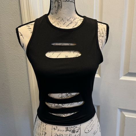 Solid Black Ripped Crop Tank Top. Size Small. New In Package Measures Approximately (Laying Flat) Armpit To Armpit 16 Length 18 Ripped Shirt Design, Punk Tops Women, How To Cut A Shirt Into A Tank Top, Ripped Clothes Aesthetic, How To Make A Tank Top, Ways To Cut T Shirts, Cut Shirt Designs Diy, Alt Crop Top, Diy Shirt Cutouts