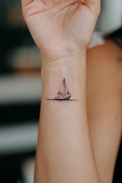 Small sailboat tattoo on a person's forearm. Wrist Tattoo Designs For Women, Sailboat Tattoo, Unique Wrist Tattoos, Wrist Tattoo Designs, Wrist Tattoo Ideas, Small Sailboats, Intricate Tattoo, Tattoo Ideas For Women, Symbols Of Freedom