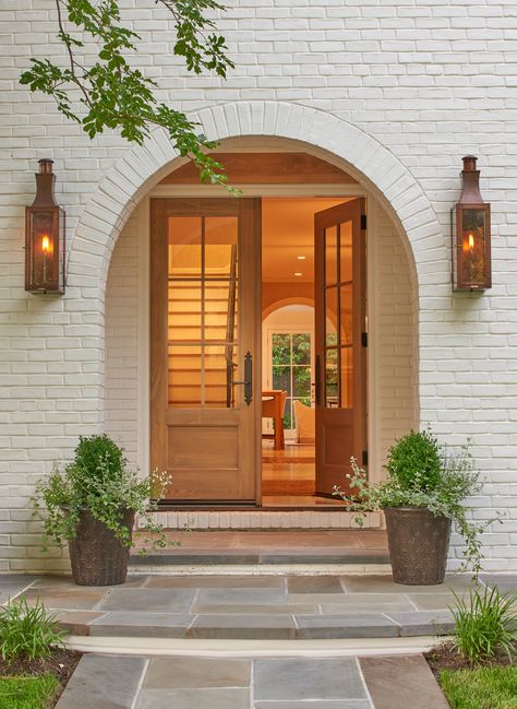 Exterior detail of arched entry  American  Architectural Details  TraditionalNeoclassical  Portico  Entryway  Architectural Detail by Thomson & Cooke Architects Modern Porch, Beautiful Front Doors, Wood Front Doors, Door Inspiration, Living Modern, Front Entrance, Front Door Design, Painted Brick, Modern Wall Sconces