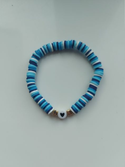 Fun coloured blue heart bracelet! This handmade bracelet is stretchable so it will fit most adults and children's wrist. This bracelet is made out of clay beads that doesn't nip or rip your skin when you wear them.  They are so comfortable! If you have any questions please contact me below. Clay Bracelet Ideas Blue, Clay Bead Bracelet Blue, Braclets Ideas Clay Beads Easy, Clay Bead Bracelet Ideas For Boys, Blue Clay Bead Bracelets, Blue Heart Bracelet, Pulseras Aesthetic, Bear Activities, Love Heart Bracelet