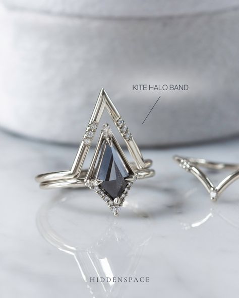 Stacked for a statement with kites all the way! Many of our wedding bands feature an architectural chevron design, perfectly crafted to complement and seamlessly stack with our unique kite-shaped engagement rings. #hiddenspace #finejewelry #kiteshapedring #saltandpepperdiamondring #artdeco #architecturaldesign #modernvintage #whitegoldring #platinumring #diamondalternative #handmadejewelry #stackingrings #weddingringset Kite Shaped Diamond Ring, Shaped Wedding Band, Kite Ring, Gothic Wedding Rings, Temptation Island, Kite Diamond, Diamond Stacks, Engagement Ring Shapes, Diamond Alternatives