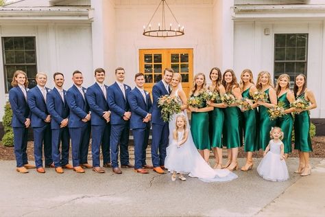 Emerald Green Bridesmaid Dresses And Navy Blue Suits, Emerald And Navy Blue Wedding, Royal Blue Emerald Green Wedding, Navy Suit Green Dress, Blue Suit Green Dress, Emerald Green And Royal Blue Wedding, Royal Blue And Emerald Green Wedding, Emerald Bridesmaid Dress With Groomsmen, Emerald Wedding Color Schemes