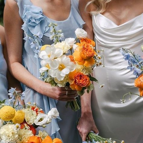 Mondo Floral Designs on Instagram: "Blooms for the B L U E S ⁠ ⁠ How stunning is this citrus inspired floral concept against the cool blue tones of the stunning bridesmaids dresses..... ⁠ ⁠ Image @beckrocchiphotography⁠ ⁠ ⁠ ⁠ ⁠ #coastal #style #sunshinecoast #noosaheads #design #wedding #weddinginspiration #bride #weddingday #weddingideas #weddingphotography #beach #ocean #flowers #love #photography #weddingflowers #floral #weddinginspo #botanical #beautiful #beauty #mondobride #mondofloraldesigns #noosaweddingflowers" Orange And Blue Bridesmaid Dresses, Yellow And Blue Bridesmaid Dresses, Citrus And Blue Wedding, Cyprus Aesthetic, Blue And Orange Wedding, Floral Beach Dress, Ocean Flowers, Light Blue Bridesmaid, Orange Bridesmaid