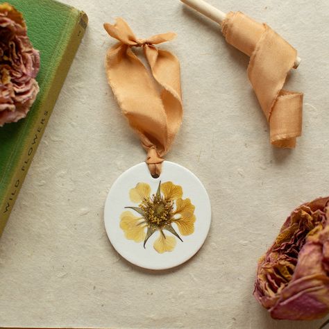 Pressed Flower Ornaments I’m delighted to let you know that my latest Collection is now live on my webshop. Beautiful homegrown and traditionally pressed flowers on handmade white clay discs, finished with stunning hand-dyed silk ribbon. There are two sizes to choose from (small: 5.5cm diameter, and large 7.5cm diameter). Perfect for festive decorations or for displaying all year round. Each one is completely unique and made with love. I hope you enjoy them. 🤍 #collectionlaunch #flowersar... Hand Dyed Silk Ribbon, Flower Ornaments, Dyed Silk, Hand Dyed Silk, White Clay, Pressed Flower, Silk Ribbon, Art Therapy, Made With Love