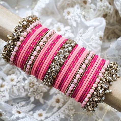 A T I Y A   C H O U D H U R Y on Instagram: “PRETTY IN PINK Bangle Set.⠀ 👆Tap on the pic for prices⁣⁣⁣ 🇬🇧 Prices are in GBP (£) ⁣⁣⁣ 🛍 Shop online at ⁣⁣⁣WWW.ATIYACHOUDHURY.COM 📧 contact…” Velvet Bangles, Pink Bangles, Thread Bangles Design, Indian Bangles, Indian Jewelry Earrings, Indian Bridal Jewelry Sets, Antique Jewellery Designs, Fancy Jewellery Designs, Jewelry Set Design