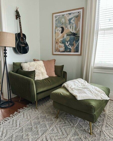 i am beyond thrilled about my new albany park armchair and coordinating ottoman. my living room genuinely needed some tlc and a nice color pop, so the olive velvet chair with gold legs was the perfect update! this chair is velvety soft and oh-so-cozy. it is perfect for relaxing with some tea and read a book. what do you think? check it out on my ltk shop! link in bio #myalbanypark @albanyparkhome Cozy Corner Chair Ideas, Ottoman For Chair, Albany Park Chair, Cozy Accent Chairs For Living Room, Green Chair Living Room Decorating Ideas, Cozy Living Room Chairs, Green Velvet Reading Chair, Lounge Chair With Ottoman, Green Chair With Ottoman