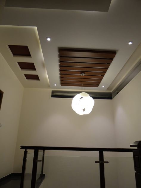 Double height lobby ceiling modern corridor, hallway & stairs by hasta architects modern | homify Ceiling Photos, Simple False Ceiling Design, Sealing Design, Wooden Ceiling Design, Fall Ceiling, Simple Ceiling Design, Pvc Ceiling Design, False Ceiling Living Room, Interior Ceiling Design