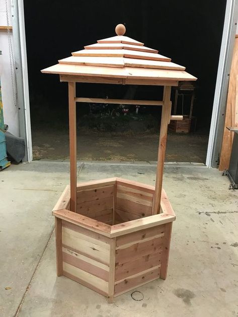 I have always wanted a wishing well in my yard but it was always lower on the priority list than some of my other projects. Well, I volunteered to create the class project for my daughter's school auction and in trying to come up with an idea for what to build, I thought of a wishing well. It's the perfect yard decor, and by building one for the school auction, I could build one for myself at the same time! ;-) Here are the abbreviated instructions for how I built my magical wis… Diy Wishing Well, Diy Wishing Wells, Wishing Well Plans, Woodworking Plans Toys, Woodworking Plans Patterns, Wishing Wells, Wood Crafting Tools, Woodworking Patterns, Woodworking For Kids