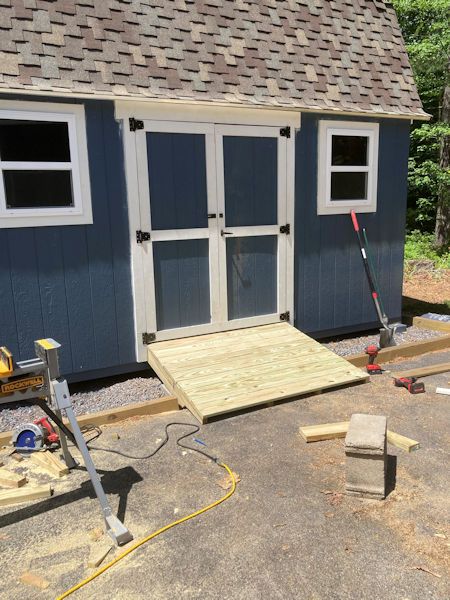 How to build a shed ramp Ramp For Shed How To Build, Shed With Ramp, Underpinning For Storage Buildings, Ramp To Shed, Build Ramp For Shed, Shed Steps Ideas, How To Build A Shed Ramp, Diy Ramp For Shed, How To Build A Ramp For A Shed