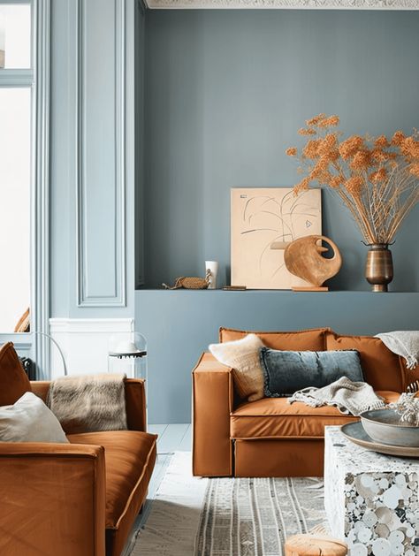 What Colors Go With A Rust Color Scheme In Your Home? [17 Color Ideas You Will Love!] Rust Furniture Living Room, Rust Complementary Colors, Light Blue And Terracotta Living Room, Beige And Terracotta Living Room, Analogous Color Scheme Interior Design, Rust And Cream Living Room, Living Room With White Floor, Blue And Orange Living Room Color Scheme, Living Room Color Scheme Ideas Bright