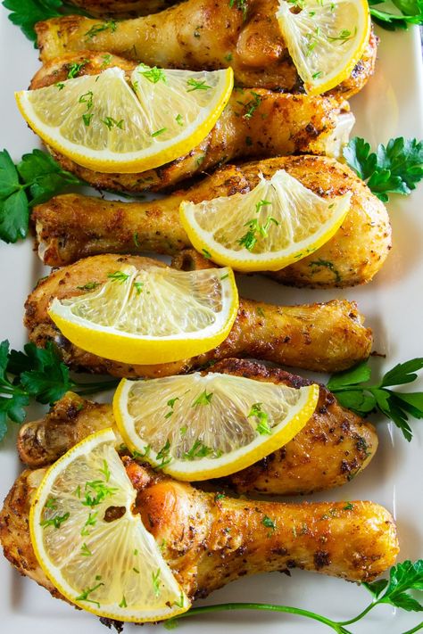 A close up of baked lemon chicken drumsticks Drumstick Recipes Oven, Chicken Legs In Oven, Wild Rose Detox Recipes, Baked Lemon Pepper Chicken, Baked Lemon Chicken, Clean Dinners, Baked Chicken Drumsticks, Chicken Baked, Chicken Leg Recipes