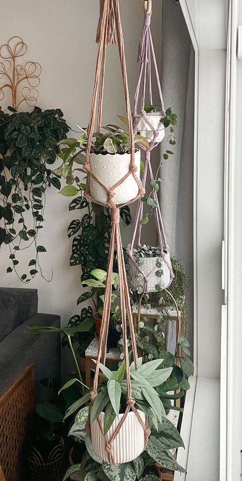 Save even more space by hanging not just one plant but two!   Each hanger is measured from top gathering knot to the bottom knot.  Lengths decrease depending on the size of pot(s) used. This hanger features a tassel less bottom and is intended for smaller to medium pots.   For 34" and 40" hangers:  Top basket can hold up to 4" pots and bottom basket can hold up to 6" pots For custom orders, please hit the "request custom order" button on my shop page. This order comes without tracking unless you Hanging Plant Pot Ideas, Triple Macrame Plant Hanger Diy, Macrame Plant Decor, Double Macrame Plant Hanger Diy, Crochet Interior Decor, Makramee Plant Hanger, Macrame Double Plant Hanger, Double Macrame Plant Hanger, Wall Hanging Decorations