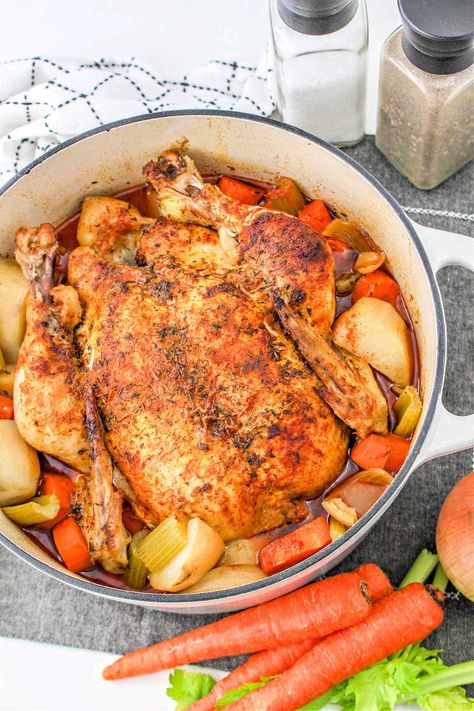 Dutch Oven pot roast chicken in the oven with vegetables is a delicious healthy meal. Seasoned whole chicken with a delicious dry rub. Dutch Oven Whole Chicken Recipes One Pot, Dutch Oven Whole Chicken And Vegetables, Dutch Oven Roast Chicken Recipes, Roast Chicken From Frozen, Whole Chicken Recipes With Vegetables, Cast Iron Whole Chicken Recipes, Whole Roasted Chicken And Vegetables, Whole Chicken In Cast Iron Dutch Oven, Roasted Chicken Whole Dutch Oven