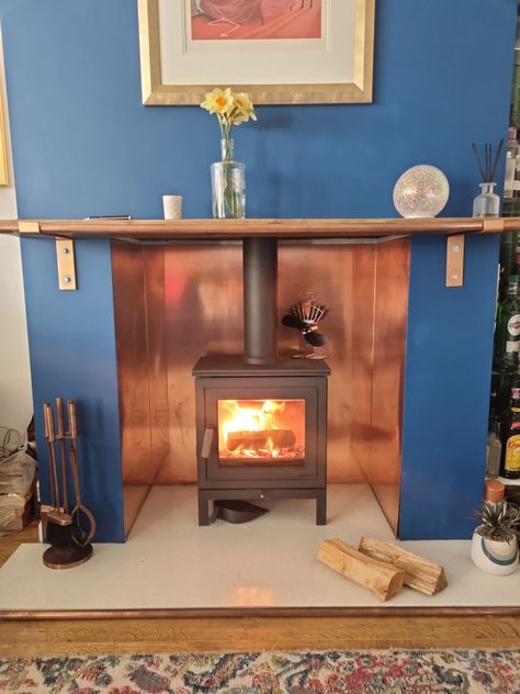 We fitted the copper sheets behind the wood stove, instead of painting it white. We love it. It's 1 full sheet rather than seperate sheets. We paid for it to be pre bent Copper Sheets, Wood Stove, Stove, Copper, Fireplace, New Homes, White, Wood