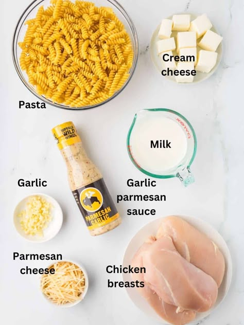 Discover the ultimate comfort food with this viral TikTok Crock Pot Garlic Parmesan Chicken Pasta Recipe! Slow-cooked to perfection, this easy pasta recipe combines tender shredded chicken with creamy cream cheese and rich Parmesan cheese, all brought together by the irresistible flavor of Buffalo Wild Wings Parmesan Garlic Sauce. Perfect for dinner, this homemade dish is easy to make with minimal effort. Pin now to save this must-try slow-cooker chicken pasta recipe! Crock Pot Garlic Parmesan Chicken, Wings Garlic Parmesan, Buffalo Pasta, Parmesan Garlic Sauce, Buffalo Wild Wings Sauces, Texas Toast Garlic Bread, Garlic Parmesan Chicken Pasta, Easy Fast Dinner, Garlic Sauce For Chicken