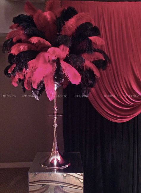 Red and black feathers burst from sleek silver bases for corporate centerpieces designed by HMR Designs Corporate Centerpieces, Feather Arrangements, Feather Centerpieces, Event Props, Decor Pieces, Black Feathers, Red And Black, Decorative Pieces, Feathers