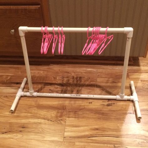 DH just finished this clothes rack for an 18 doll. I haven't fixed it up yet. But, I plan to remove all of the stickers ( ) ! I will probably find a Diy Clothes Rack Pvc, Doll Clothes Storage Ideas, Doll Organization, Doll Clothes Hangers, Doll Storage, Diy Clothes Rack, American Girl Doll House, American Girl Doll Furniture, American Girl Doll Diy