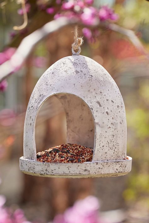 Suitable for any type of bird seed, this resin feeder’s minimalist design blends beautifully into the garden. Bird Feeder Design, Ceramic Bird Feeders, Pottery Bird Feeders, Pottery Bird Feeder, Ceramic Bird Feeder, Ceramic Bird Bath, Best Bird Feeders, Hanging Bird Feeder, Ceramic Birdhouse