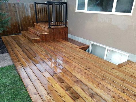 Floating Deck With Stairs, Small Ground Level Deck Ideas, Floating Deck Ideas Ground Level, Townhouse Deck Ideas, Ground Level Deck Plans, Deck Vs Patio, Deck Alternatives, Lakehouse Exterior, Brown Deck