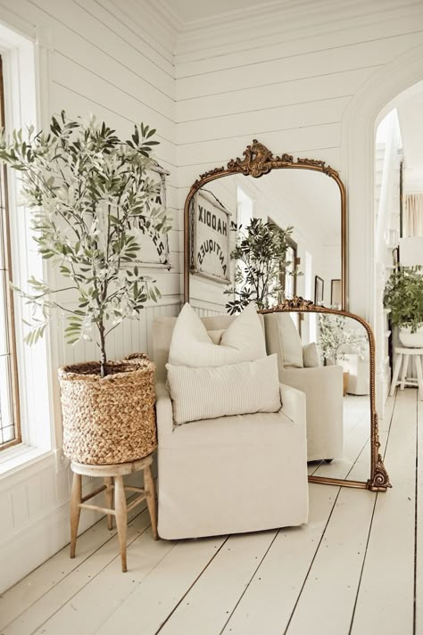 Get The Most Beautiful Mirror In The World For Free Mirror On Floor Living Room, Floor Mirror Next To Chair, Antique Style Interior Design, Cozy White Cottage Bedroom, Arhaus Floor Mirror, Layer Mirror And Art, Plant By Mirror, Beautiful Corners In The House, Floor Mirror In Living Room Ideas