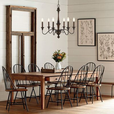 Based on historic wrought iron chandeliers, our rustic 6-light design features a quality wood-look finish. Perfectly sized for a farmhouse dining room, tall entry, or kitchen with high ceilings, our chandelier is just 25" wide and features tall candles with LED candle bulbs. Use this versatile chandelier in a modern farmhouse, French country or Tuscan style home, or to add character to a rustic, industrial space. | Canora Grey Oakley 25" 6-Light Midcentury Farmhouse Iron LED Chandelier, Wood Fin Midcentury Farmhouse, Table Finishes, Chandelier Wood, Farm House Dining Room, Modern Farmhouse Furniture, Tuscan Style Homes, Vintage Dining Room, House Decor Rustic, Farmhouse Dining Table