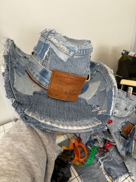 Reworked Levi denim cowboy hat  Hand  made great for summer parties 🎉 🍒🪩🤠 Great for standing out  Great for looking 👀 good  Pool party 🎉  This is one size ! The Head circumference inside the hat is 23"  I have one hat left atm it's the one in the first 3 pictures so ready to post out   All items are handmade by myself I make the hat once ordered unless I have any already made to send out !! Please note all hats will be slightly different as there all hand made with the denim I have in stock on the day 💙 No Hat will be the Same I can make as close to what you ask for but please understand all denim is different in colour and textures 💕 With this  hat it would be a case of ordering and if I have in stock I will send out. If not you will need to allow a few days to be made. Denim Cowboy Hat, Recycled Denim Fashion, Denim Hats, Denim Cowboy, Custom Cowboy Hats, Chain Skirt, Cute Cowgirl Outfits, Denim Crafts Diy, Denim Art