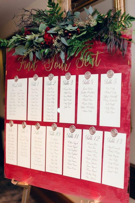 Ballroom Wedding | Red and Navy Wedding | Burgundy Wedding | Seating Chart | Wedding Signs | Wedding Reception | For more ballroom wedding ideas, visit burghbrides.com! Christmas Wedding Wreath, Christmas Table Plan Wedding, Christmas Wedding Place Cards, Christmas Wedding Backdrop Ideas, December Wedding Decor, Christmas Ornament Seating Chart, Christmas Wedding Food Ideas, Christmas Wedding Head Table, Seating Chart Christmas