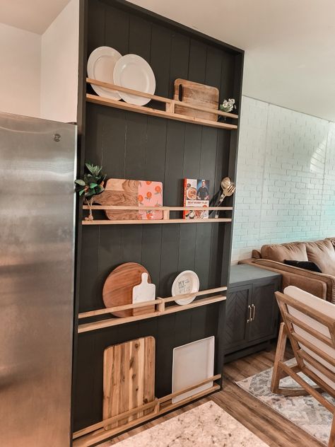 Moody green diy plate rack Half Wall Backsplash Kitchen, Modern Plate Rack Wall, Shiplap Wall Shelves, Charcuterie Board Storage, Charcuterie Wall Display, Feature Wall Kitchen Ideas, Stained Vertical Shiplap, Vertical Shiplap Wall With Floating Shelves, Breakfast Nook Accent Wall