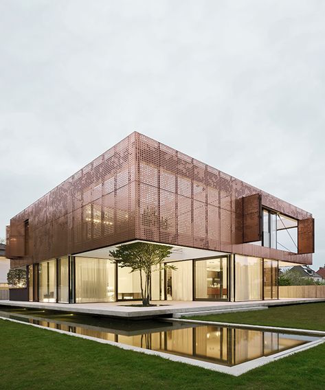 liebel architekten wraps house in niederbayern, germany, in perforated copper façade Copper Cladding Architecture, Brass Facade Architecture, Copper Facade Architecture, Roof Ideas Architecture, Steel Facade Architecture, Copper Architecture, Copper Facade, Copper Building, Copper In Architecture