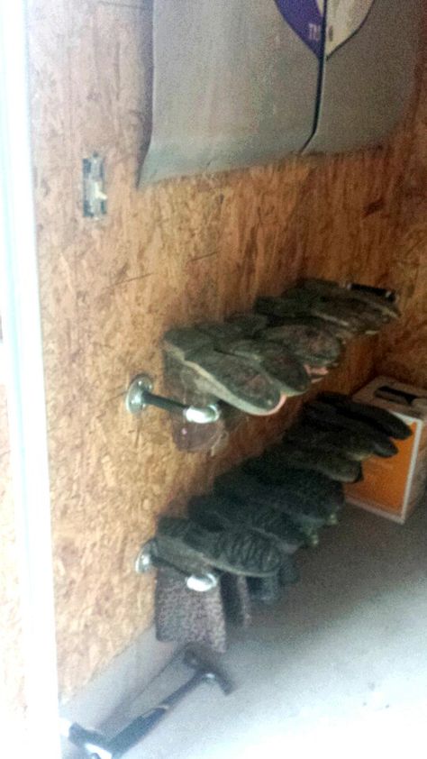 Boot rack for garage Boot Hangers Diy, Garage Boot Rack, Corrugated Metal Wall, Boot Hanger, Water Boots, Ranch Boots, Chicken Houses, Boot Organization, Furniture Remodeling