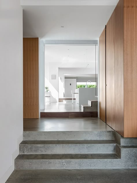 Hallway and Concrete Floor Internal brick walls and polished concrete surfaces provide thermal mass that help keep the interior spaces cool. Sunken House, Beach House Stairs, Polished Concrete Floor, New Modern House, Passive House Design, Eco Friendly Interior, Concrete Interiors, Concrete Flooring, Concrete Houses