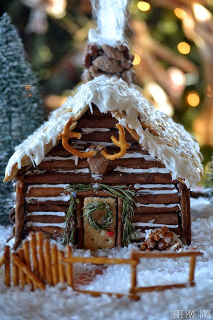 Three Pixie Lane: Gingerbread Log Cabin - I cannot stand how CUTE this is! Especially love the pretzel 'antlers'! Gingerbread Log Cabin, Homemade Gingerbread House, Gingerbread House Ideas, Cool Gingerbread Houses, Ginger Bread House Diy, Jul Diy, Gingerbread House Parties, Gingerbread House Designs, Gingerbread Party