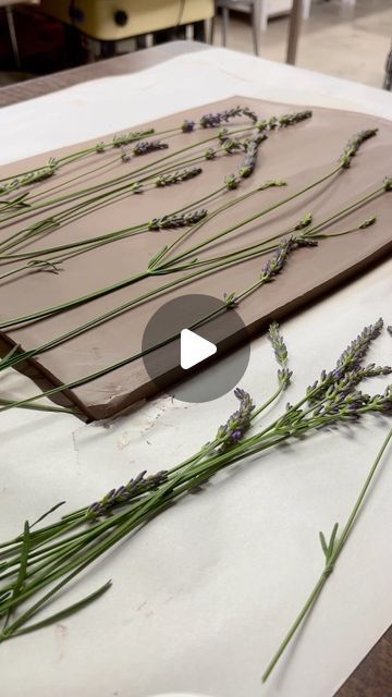 Christine Stangel on Instagram: "Lavender is my most favorite flower of all time! Plus, the lovely aroma that fills my studio after pressing them into clay is unbelievable. Charcuterie boards with imprinted lavender from my very own garden…  coming soon!  #csstangelpottery" Pressing Flowers Into Clay, Flower Imprints In Clay, Pressing Lavender, Pottery Charcuterie Board, Clay Charcuterie Board, Ceramic Charcuterie Board, Clay Imprints, Texture Pottery, Surface Decorations