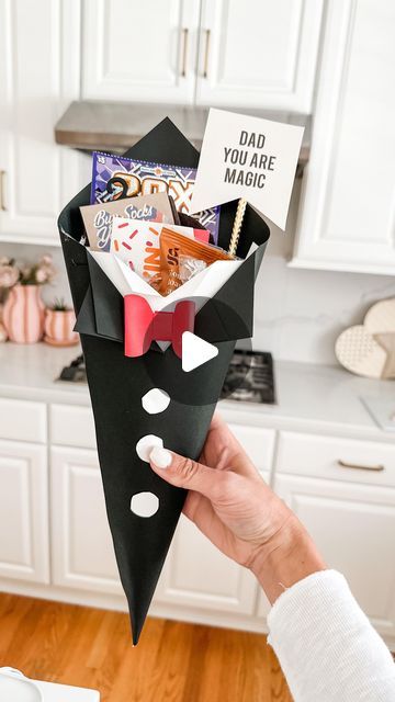 Mimi Markopoulos on Instagram: "🖤Father’s Day DIY - Paper Tuxedo Cone🤍 .  Stumbled upon this adorable DIY project by the talented creator @bellarteskids on TT and instantly felt inspired to give it a go, especially since I had all the necessary materials on hand! This simple yet charming DIY idea is ideal for crafting the perfect Father’s Day gift vessel.  The lovely Father’s Day print I used is from @oliveandeveco! Their collection of printables for various holidays is simply amazing, and at just $5, O&E offers fantastic options to elevate your gifts and decor. 😍 . More Father’s Day DIY ideas coming up 🤍🤍 . . . . . . #fathersday #fathersdaydiy #fathersdaygift #craftymom #girl@im #mdblogger #mdgirlmom #makeitwithmichaels #cardstockcrafts #cardstock" Father Day Decoration Ideas, Fathersday Gift Diy, Fathers Day Gifts Ideas From Kids Diy, Fathers Day Activities For Kids, Father's Day Decorations Ideas, Fathers Day Decoration Ideas, Diy Father's Day Gifts Easy, Fathersday Gift Ideas, Fathers Day Activities