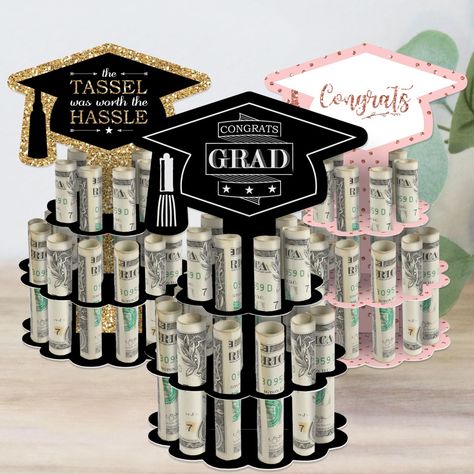 Assorted Grad Cash Cakes includes 3 DIY money cake holders that can each hold up to 20 rolled bills. The College or High School Grad money cake centerpieces SIZE 6.5 inches tall, base and center layers SIZE 3.75 inches in diameter, and top layer SIZE 2.5 inches in diameter. Circle slot cut-outs measure 0.5 inches in diameter. Unique Gift: Great for any Graduation Party, the Grad cash cake stand assortment are a trendy and creative way to gift money. You can place rolled-up money into each slot o Diy Money Cake, Cash Cake, Diy Grad Cap, Diy Graduation Party, Creative Graduation Gifts, Grad Diy, Graduation Money Gifts, Graduation Gifts For Guys, College Grad Gifts