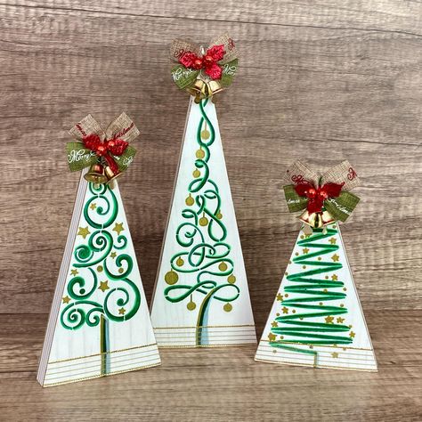 A set of 3 pine wood triangle Christmas trees featuring abstract swirled design. Add a holiday touch to your mantle, table, entry, shelf or tiered tray. Christmas magic is in the air! 🎄 Hand-painted and sealed, trimmed in ribbon, and topped with a Merry Christmas bow.  Heights are approximately 9.25", 7.25", and 5.5", 3.5" wide, and .75" thick, stand alone on flat surface.  Photo props not included.  More Christmas and Winter here! https://www.etsy.com/your/shops/DaisyMeCrafts/tools/listings/section:42995571 Abstract Christmas Tree, Wooden Christmas Trees Diy, Wooden Xmas Trees, Gold Christmas Tree Decorations, Pretty Christmas Trees, Pencil Christmas Tree, Christmas Crafts To Sell, Christmas Tree Decorating Themes, Red Christmas Tree