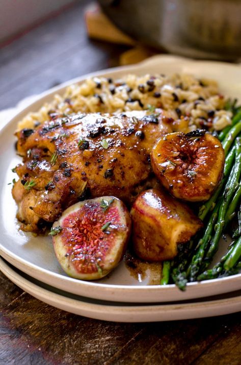 Uniquely its own, this balsamic fig chicken recipe is super flavor. The sauce has thyme, honey, and garlic to round out and balance the flavors of the balsamic vinegar and the chicken thighs are perfectly crispy on top. The sauce doesn't make them soggy. Serve it with rice and green beans (like Hello Fresh) for a well rounded and perfect early autumn dinner. #figs #dinner #recipe #chicken #homemade #easy Fig And Balsamic Chicken, Balsamic Chicken And Figs, Fig Meat Recipes, Fig And Chicken Recipes, Balsamic Fig Glazed Chicken, Chicken With Figs, Chicken Fig Recipes, Fresh Fig Recipes Dinner, Fig Chicken Recipes