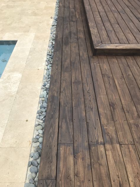 Travertine with Mexican beach pebbles and wood deck Raised Wood Patio, Pebbles Around Pool, Pool Wood Deck, Wooden Pool Deck, Mahogany Deck, Pool 2023, Wood Pool Deck, Deck Stains, Travertine Deck