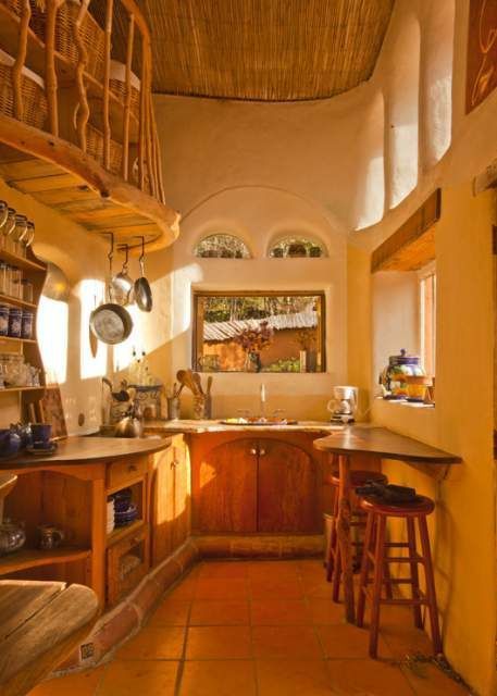 A cozy, cute kitchen of cob construction. Cob House Interior, Casa Hobbit, Straw Bale House, Earthship Home, Cob House, Farm Kitchen, Earth Homes, Old Farm Houses, Earthship