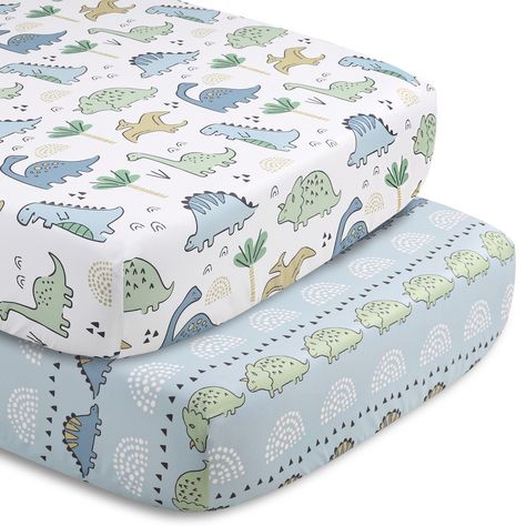 Bring the adventure indoors with this 5-piece Blue Dino baby bedding set from The Peanutshell. Our generously sized 32" x 41" soft and cozy quilt features three blue and green dinosaur friends with geometric landscape details. The character tossed fitted crib sheet comes in a perfect universal fit, designed for a standard 28" x 52" crib mattress with snug fitting all around elastic. A second fitted sheet print features a linear parade of stegosaurus and triceratops on a light blue background. Ou Dinosaur Boy Nursery, Dinosaur Nursery Baby Boy, Dinosaur Crib Sheets, Dinosaur Baby Room, Dino Room, Dinosaur Patterns, Landscape Details, Dinosaur Bedding, Geometric Landscape